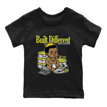 Built Different Since Birth baby and kids t-shirt crafted for little sneakerheads to shine with the Air Max 90 Cyber sneakers, displayed in Black 2.