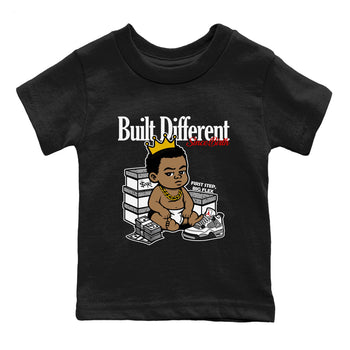 Bulit Different Since Birth baby and kids t-shirt crafted for little sneakerheads to shine with the Air Jordan 4 White Cement sneakers, displayed in Black 2.