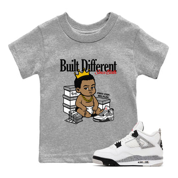 Bulit Different Since Birth baby and kids t-shirt crafted for little sneakerheads to shine with the Air Jordan 4 White Cement sneakers, displayed in Heather Grey 1.