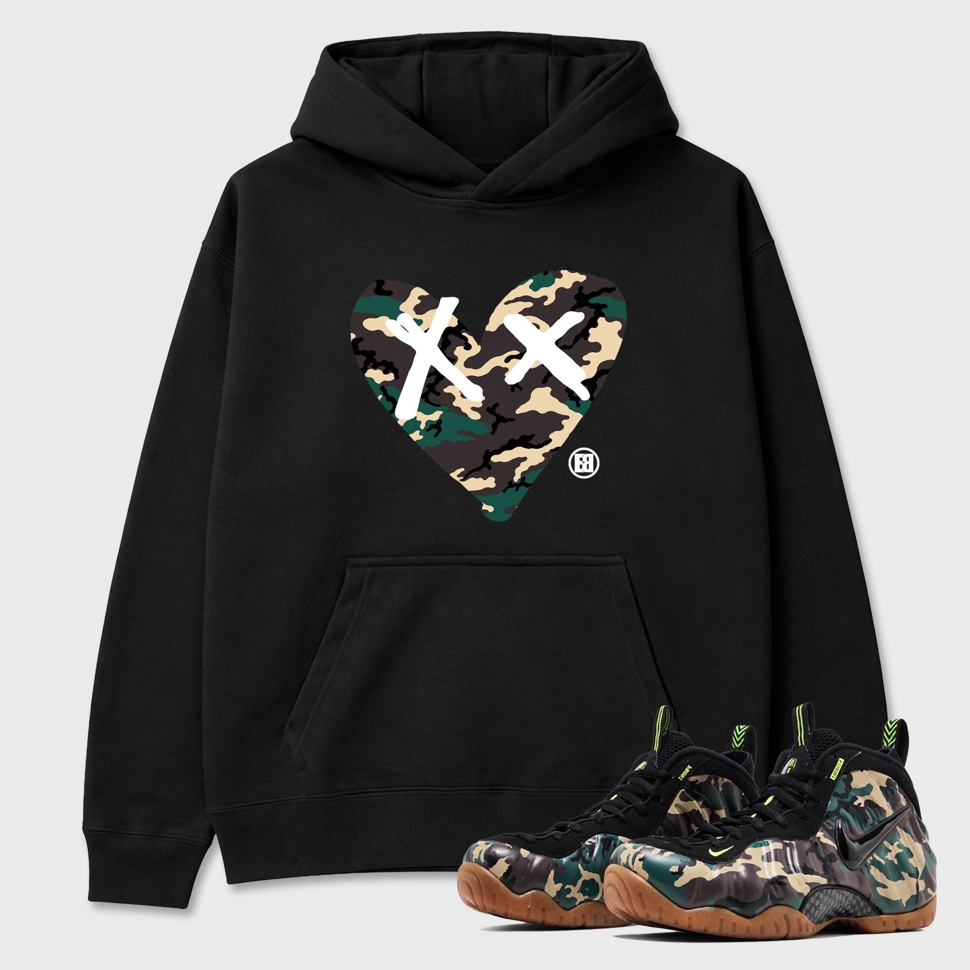 Camo Heart Graphic T-Shirt featuring original streetwear artwork designed to match the Air Foamposite Pro Green Camo. Black 1 Graphic Tee.