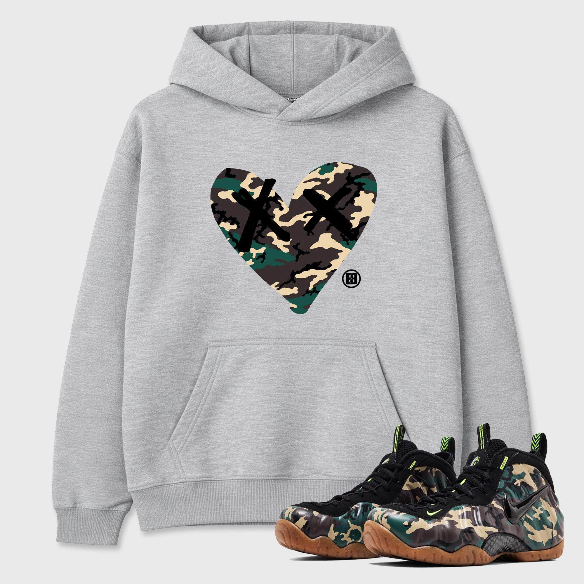 Camo Heart Graphic T-Shirt featuring original streetwear artwork designed to match the Air Foamposite Pro Green Camo. Heather Grey 1 Graphic Tee.