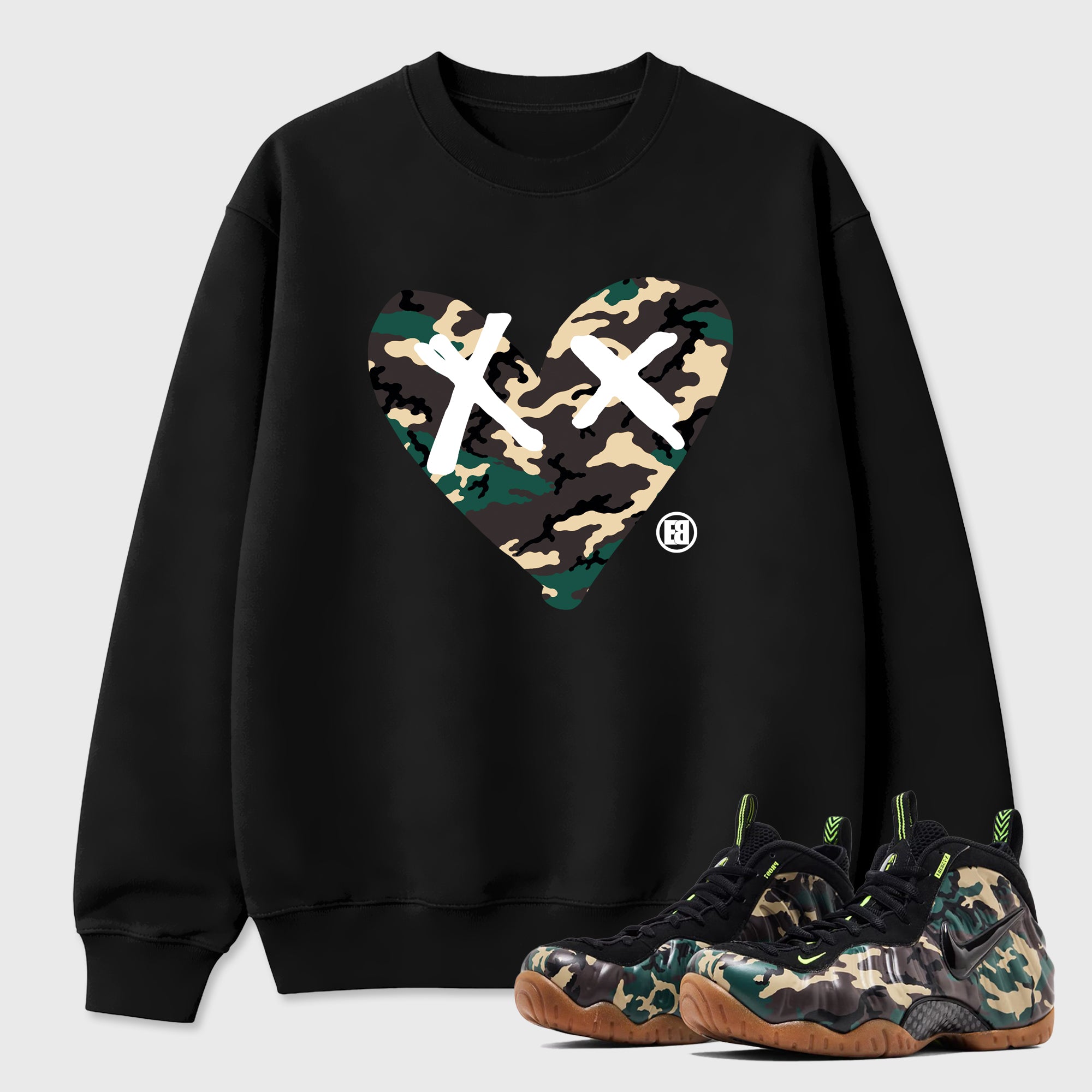 Camo Heart Graphic T-Shirt featuring original streetwear artwork designed to match the Air Foamposite Pro Green Camo. Black 1 Graphic Tee.