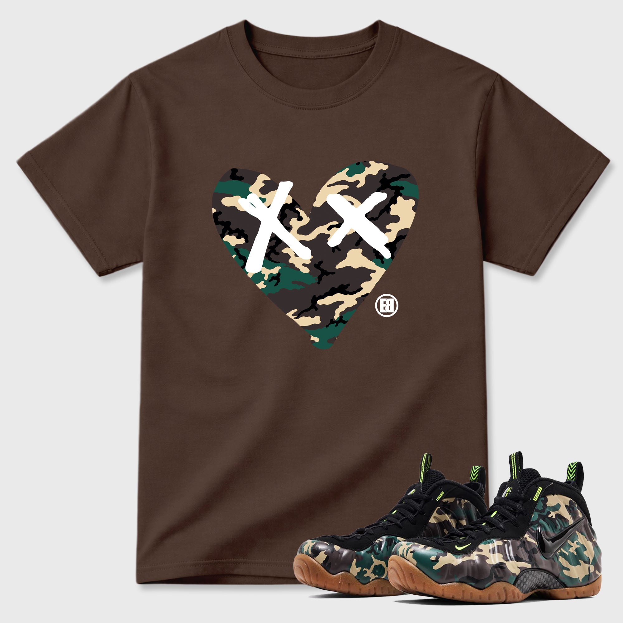Camo Heart Graphic T-Shirt featuring original streetwear artwork designed to match the Air Foamposite Pro Green Camo. Dark Chocolate 1 Graphic T-Shirt.