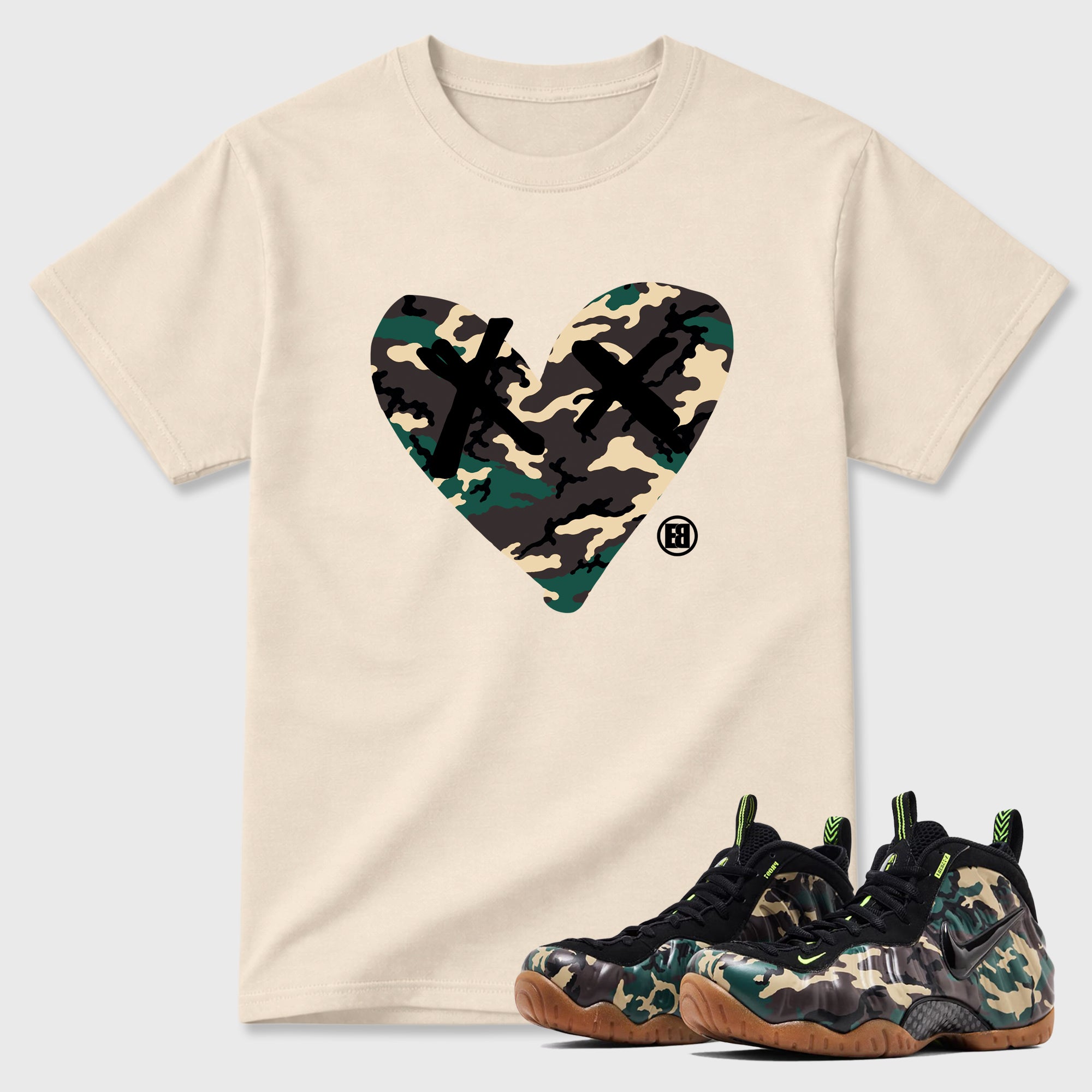 Camo Heart Graphic T-Shirt featuring original streetwear artwork designed to match the Air Foamposite Pro Green Camo. Natural 1 Graphic T-Shirt.
