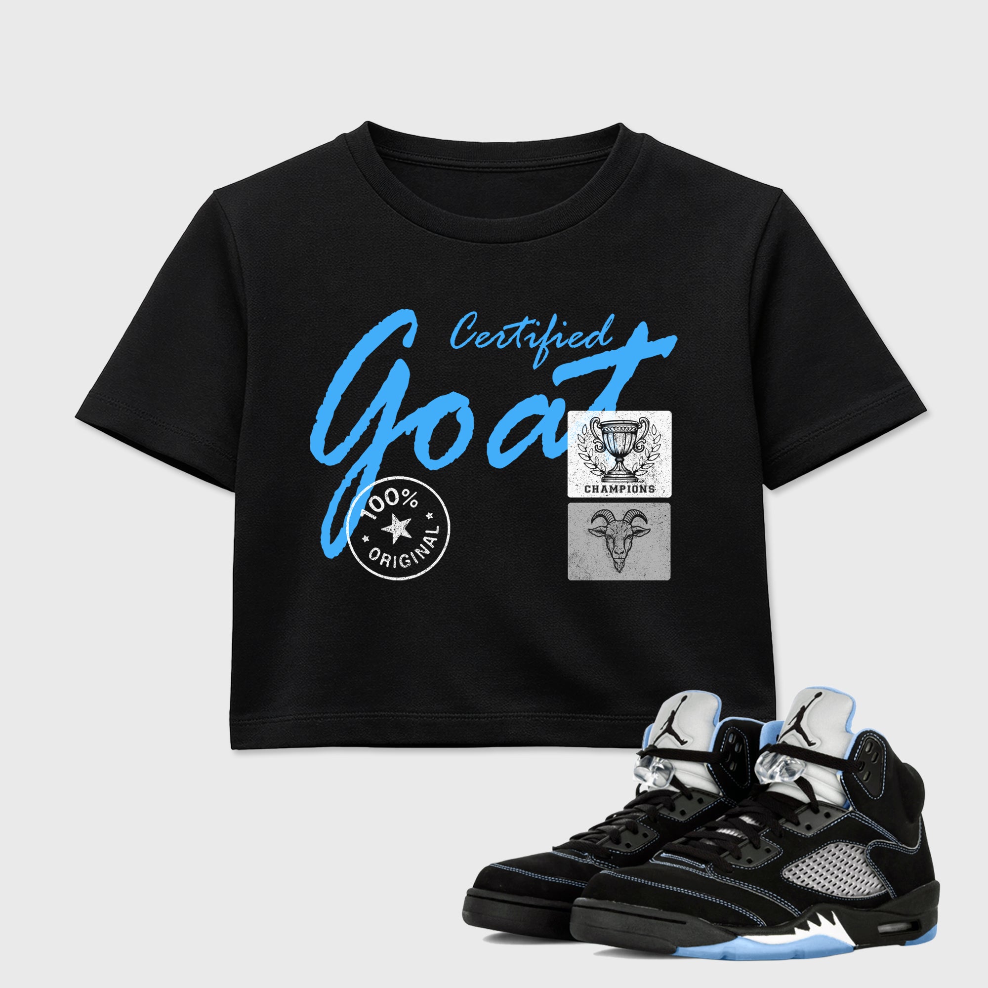 Certified Goat women’s crop tee designed to match the Air Jordan 5 Black Carolina, featuring coordinated Black 1 options for a perfect streetwear vibe.