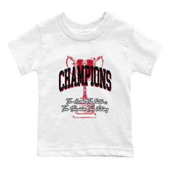Champions Trophy baby and kids t-shirt crafted for little sneakerheads to shine with the Air Jordan 1 Ruby sneakers, displayed in White 2.