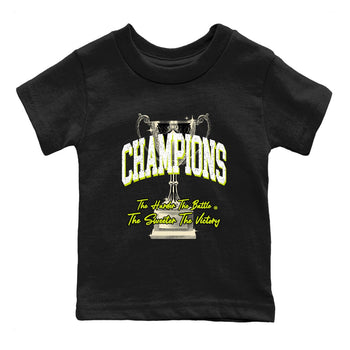 Champions Trophy baby and kids t-shirt crafted for little sneakerheads to shine with the Jordan Jumpman Jack Travis Scott Bright Cactus sneakers, displayed in Black 2.