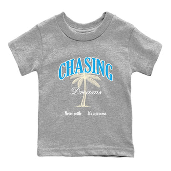 Chasing Dreams baby and kids t-shirt crafted for little sneakerheads to shine with the Air Jordan 1 UNC Reimagined sneakers, displayed in Heather Grey 2.