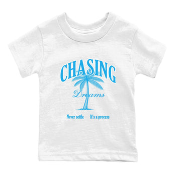 Chasing Dreams baby and kids t-shirt crafted for little sneakerheads to shine with the Air Jordan 1 UNC Reimagined sneakers, displayed in White 2.
