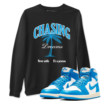 Chasing Dreams sneaker match t-shirt styled to complete your fit with the Air Jordan 1 UNC Reimagined sneakers, shown in Black 1.
