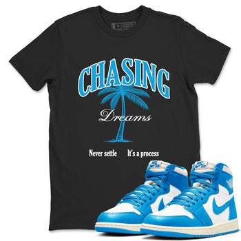 Chasing Dreams sneaker match t-shirt styled to complete your fit with the Air Jordan 1 UNC Reimagined sneakers, shown in Black 1.