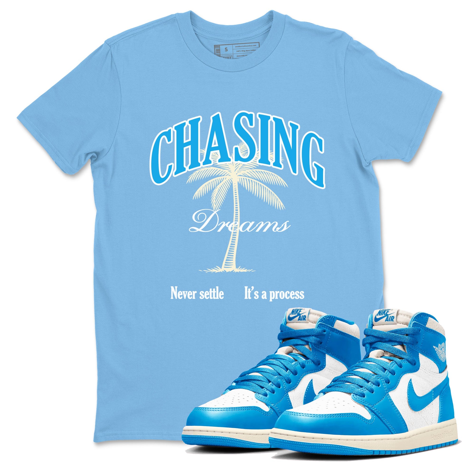 Chasing Dreams sneaker match t-shirt styled to complete your fit with the Air Jordan 1 UNC Reimagined sneakers, shown in Carolina Blue 1.