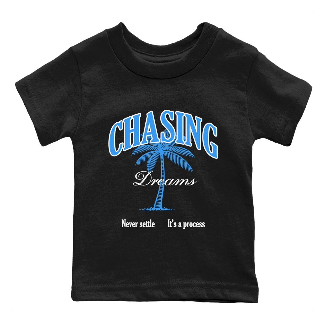 Chasing Dreams baby and kids t-shirt crafted for little sneakerheads to shine with the Air Jordan 12 White and University Blue sneakers, displayed in Black 2.