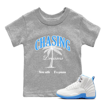 Chasing Dreams baby and kids t-shirt crafted for little sneakerheads to shine with the Air Jordan 12 White and University Blue sneakers, displayed in Heather Grey 1.