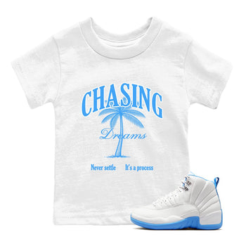 Chasing Dreams baby and kids t-shirt crafted for little sneakerheads to shine with the Air Jordan 12 White and University Blue sneakers, displayed in White 1.