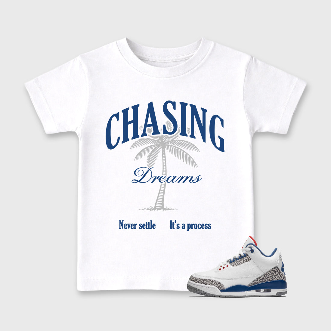 Chasing Dreams Baby & Kids Graphic T-Shirt featuring original artwork designed to match the Air Jordan 3 True Blue. White 1 Kids Graphic Tee.