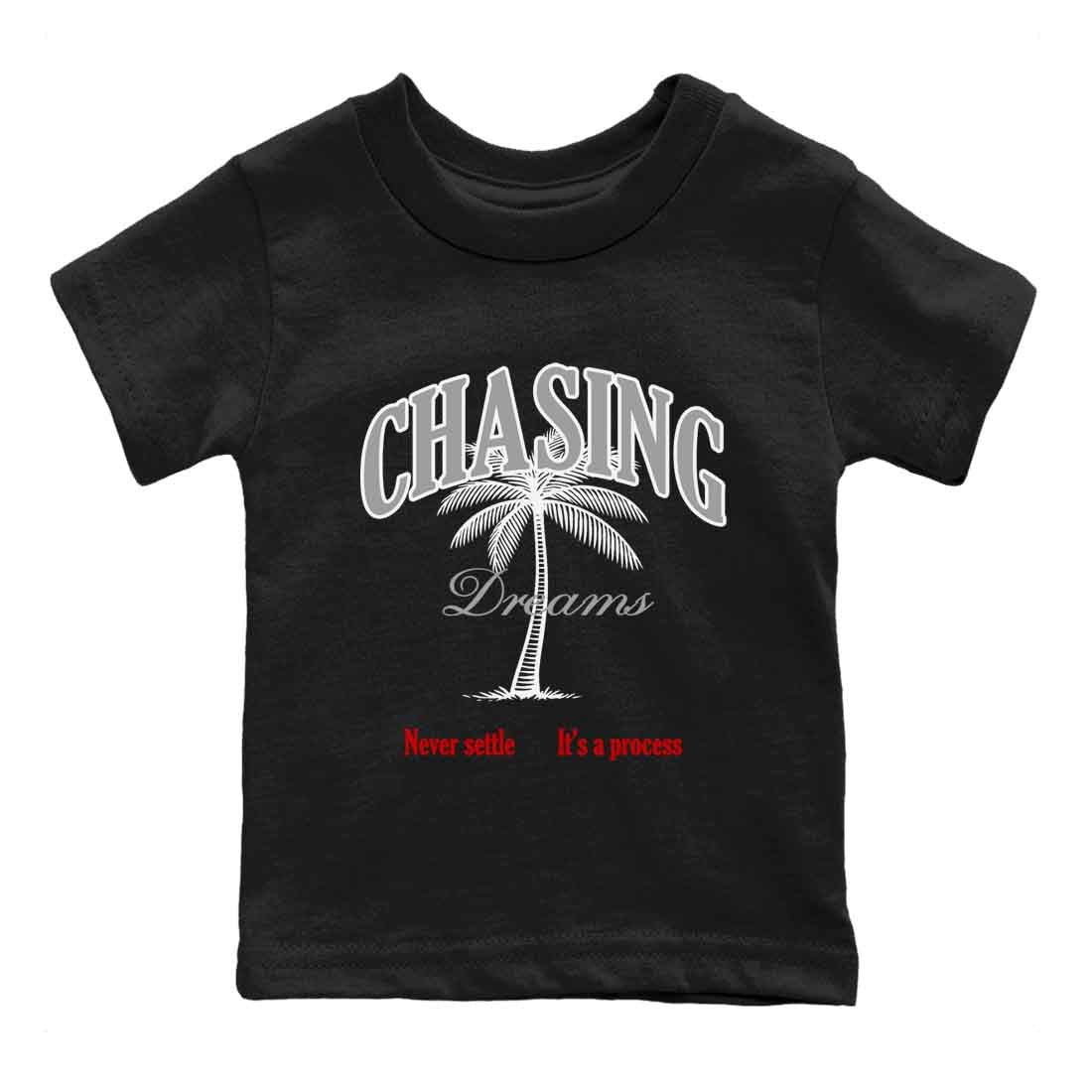 Chasing Dreams baby and kids t-shirt crafted for little sneakerheads to shine with the Air Jordan 4 White Cement sneakers, displayed in Black 2.