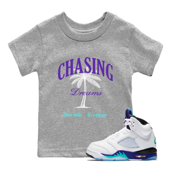 Chasing Dreams baby and kids t-shirt crafted for little sneakerheads to shine with the Air Jordan 5 Grape sneakers, displayed in Heather Grey 1.