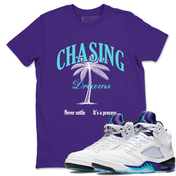 Chasing Dreams sneaker match t-shirt styled to complete your fit with the Air Jordan 5 Grape sneakers, shown in Purple 1.