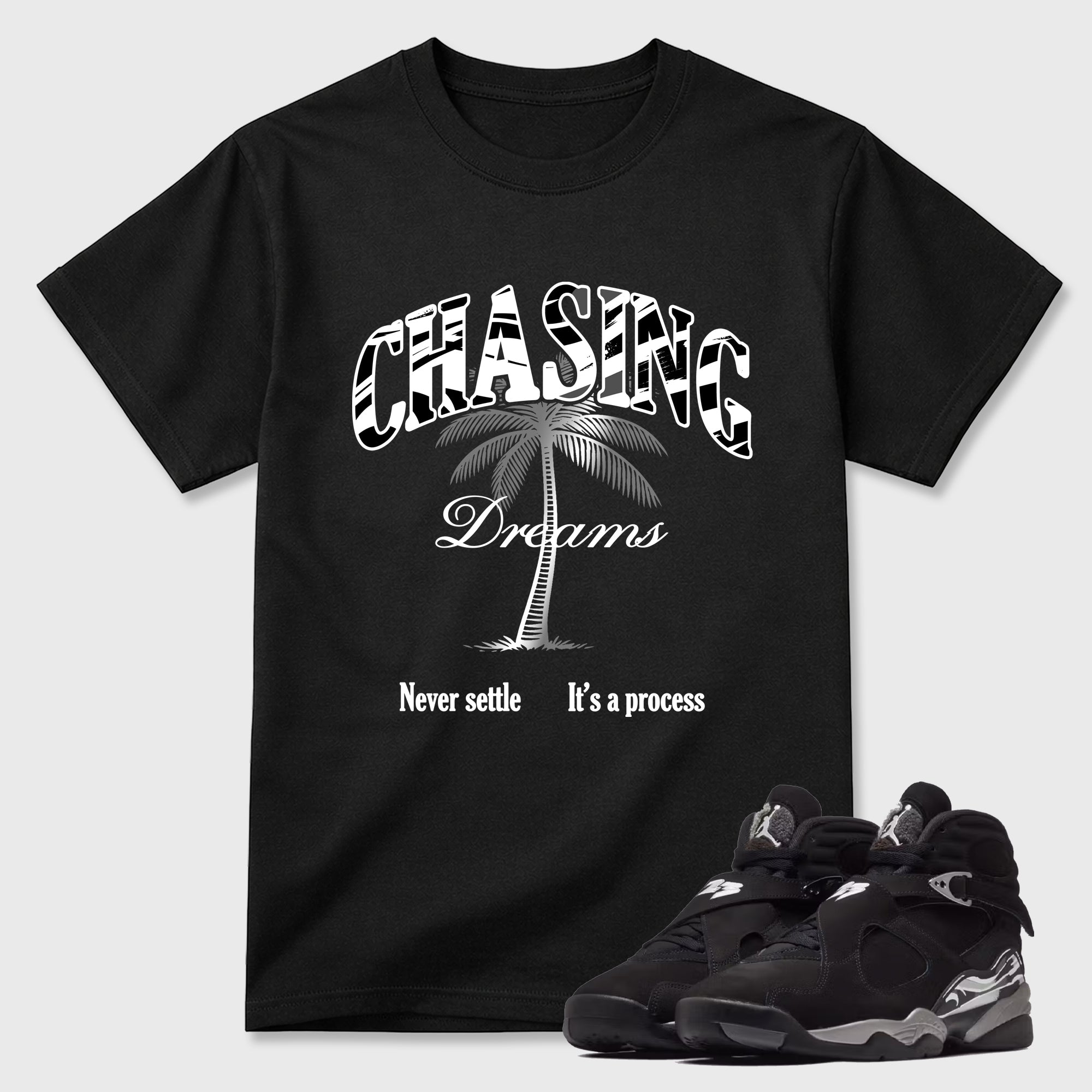 Chasing Dreams Graphic T-Shirt featuring original streetwear artwork designed to match the Air Jordan 8 Chrome. Black 1 Graphic T-Shirt.