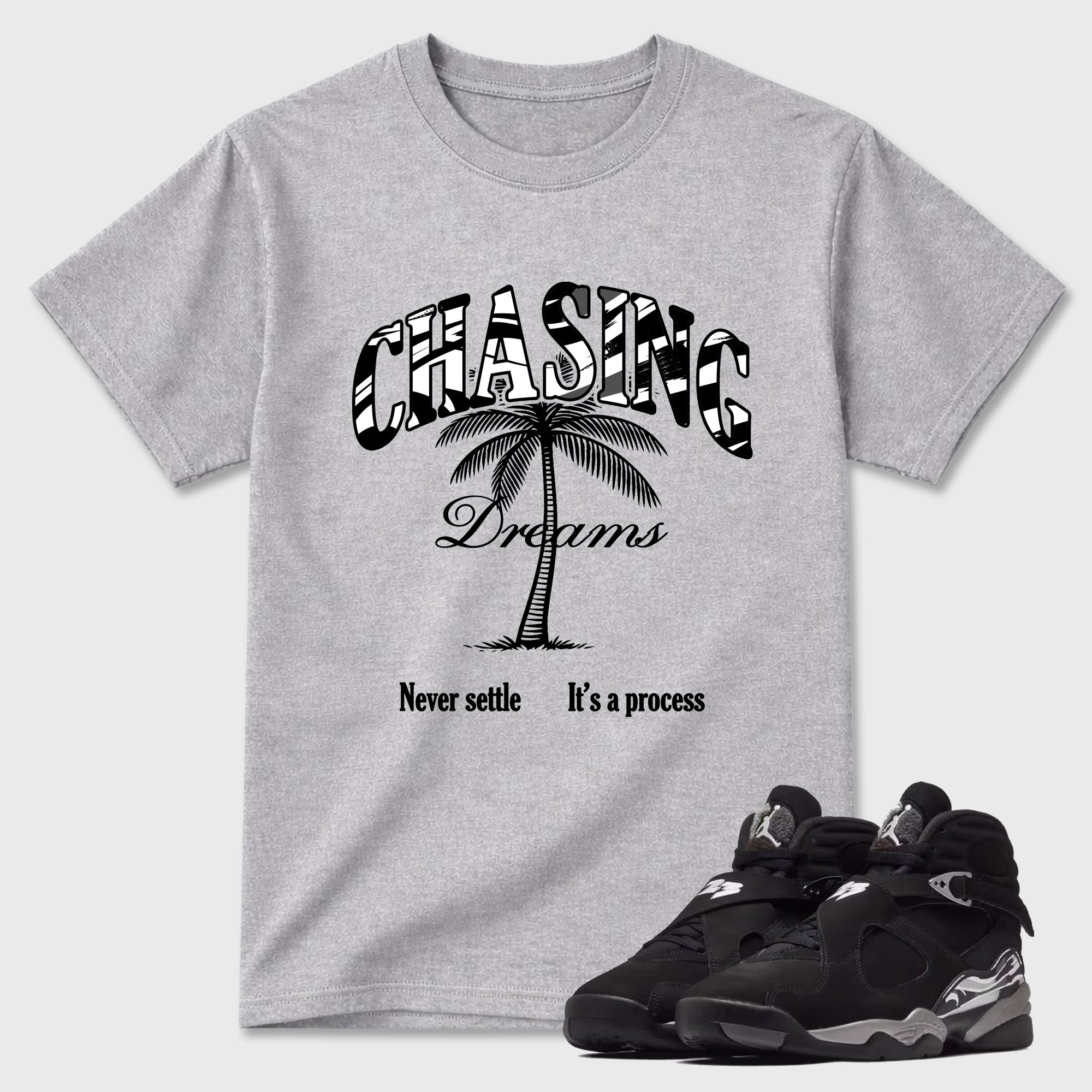 Chasing Dreams Graphic T-Shirt featuring original streetwear artwork designed to match the Air Jordan 8 Chrome. Heather Grey 1 Graphic T-Shirt.