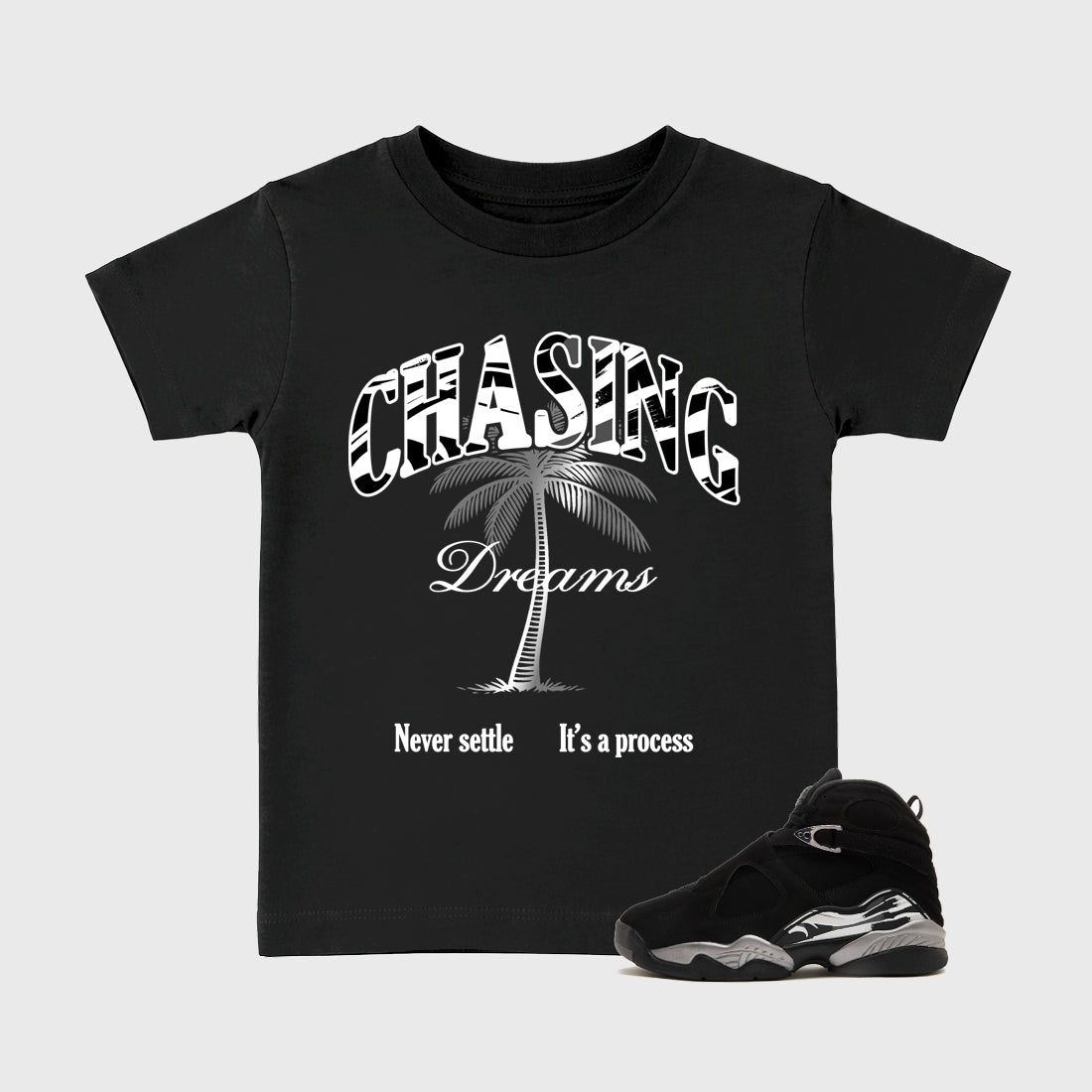 Chasing Dreams Baby & Kids Graphic T-Shirt featuring original artwork designed to match the Air Jordan 8 Chrome. Black 1 Kids Graphic Tee.