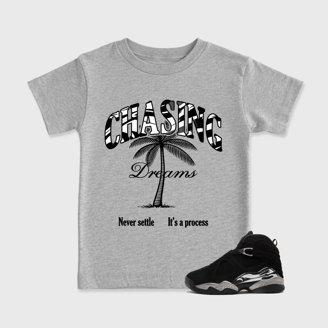 Chasing Dreams Baby & Kids Graphic T-Shirt featuring original artwork designed to match the Air Jordan 8 Chrome. Heather Grey 1 Kids Graphic Tee.