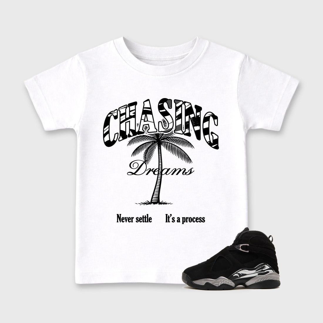 Chasing Dreams Baby & Kids Graphic T-Shirt featuring original artwork designed to match the Air Jordan 8 Chrome. White 1 Kids Graphic Tee.