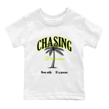 Chasing Dreams baby and kids t-shirt crafted for little sneakerheads to shine with the Jordan Jumpman Jack Travis Scott Bright Cactus sneakers, displayed in White 2.