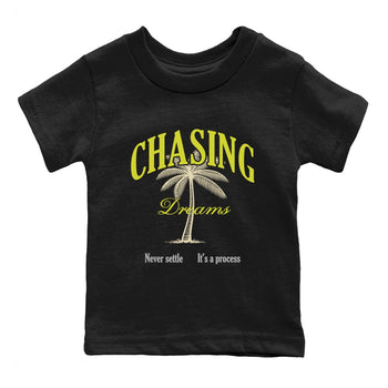 Chasing Dreams baby and kids t-shirt crafted for little sneakerheads to shine with the Air Max 90 Cyber sneakers, displayed in Black 2.