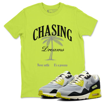 Chasing Dreams sneaker match t-shirt styled to complete your fit with the Air Max 90 Cyber sneakers, shown in Safety Green 1.