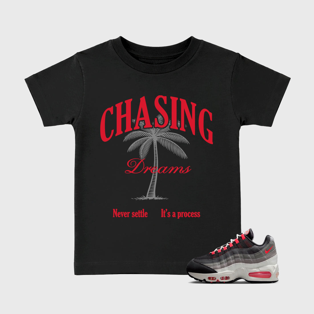 Chasing Dreams Baby & Kids Graphic T-Shirt featuring original artwork designed to match the Air Max 95 Reverse Solar Red. Black 1 Kids Graphic Tee.