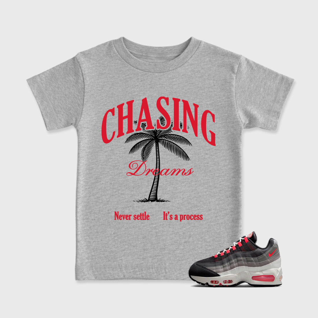 Chasing Dreams Baby & Kids Graphic T-Shirt featuring original artwork designed to match the Air Max 95 Reverse Solar Red. Heather Grey 1 Kids Graphic Tee.