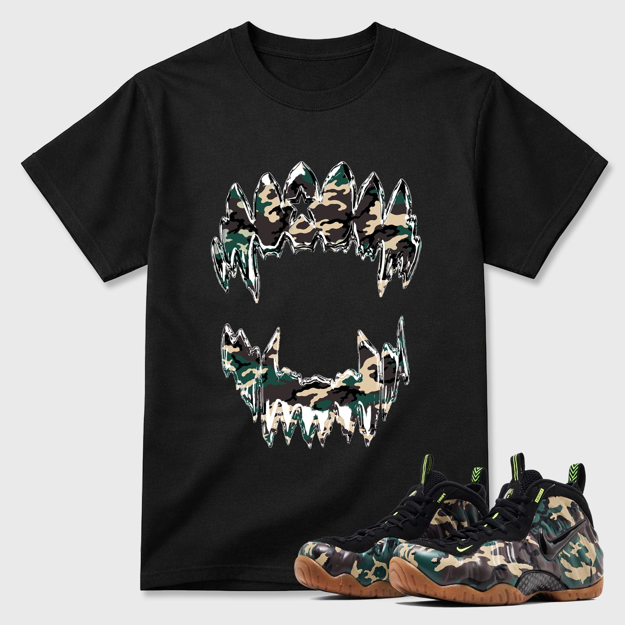 Chrome Grill Graphic T-Shirt featuring original streetwear artwork designed to match the Air Foamposite Pro Green Camo. Black 1 Graphic T-Shirt.
