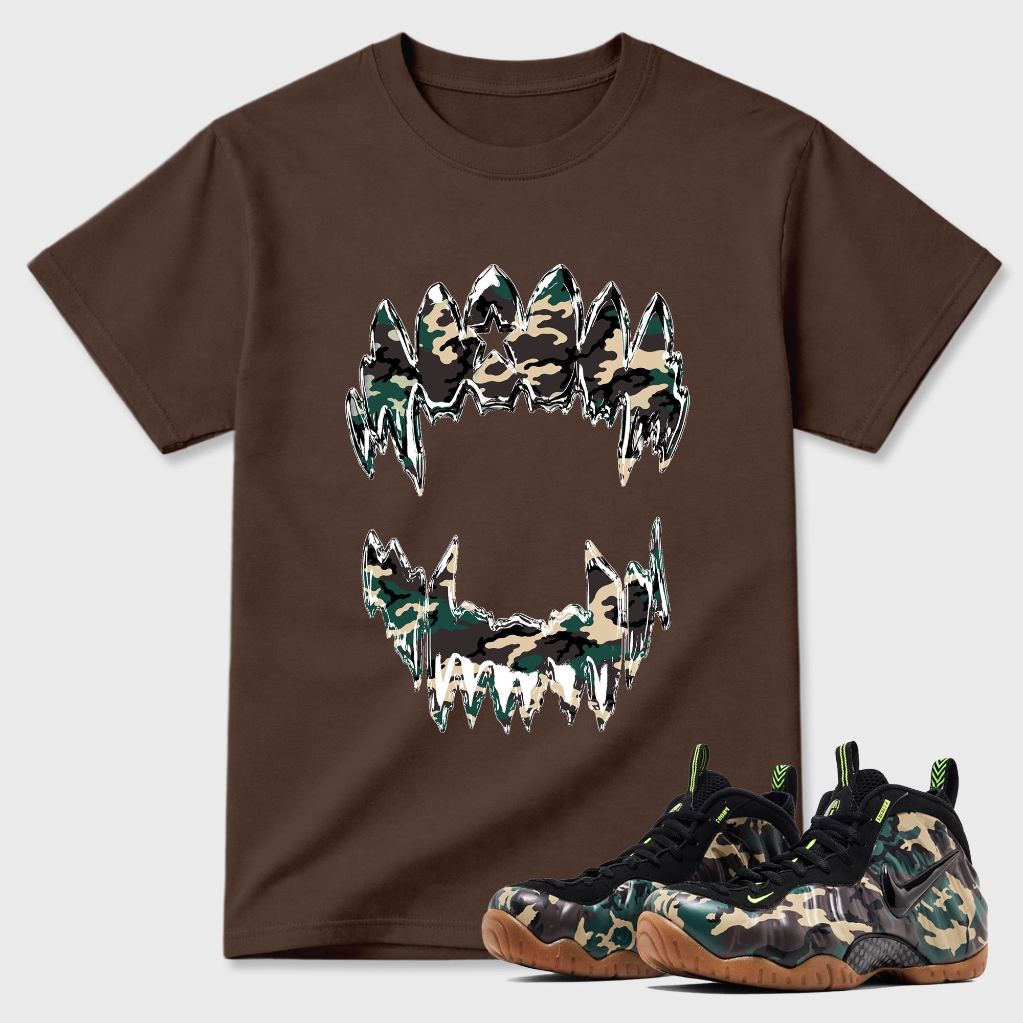 Chrome Grill Graphic T-Shirt featuring original streetwear artwork designed to match the Air Foamposite Pro Green Camo. Dark Chocolate 1 Graphic T-Shirt.