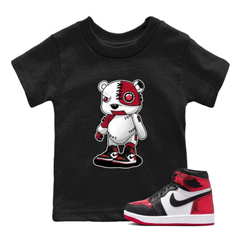 Cyborg Bear baby and kids t-shirt crafted for little sneakerheads to shine with the Air Jordan 1 Ruby sneakers, displayed in Black 1.