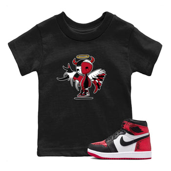 Devil Angel baby and kids t-shirt crafted for little sneakerheads to shine with the Air Jordan 1 Ruby sneakers, displayed in Black 1.