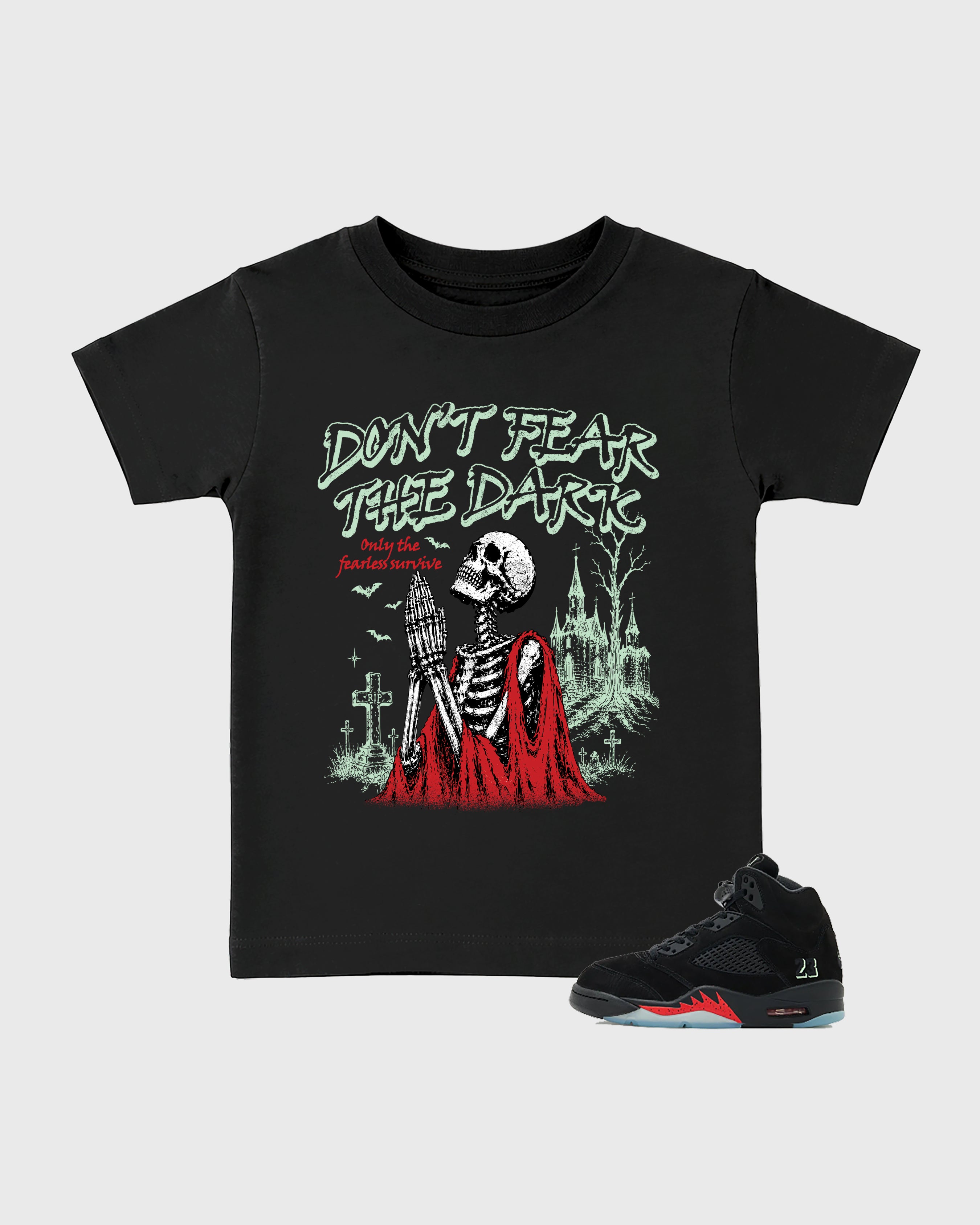 Don't Fear the Dark Baby & Kids Graphic T-Shirt featuring original artwork designed to match the Air Jordan 5 Halloween. Black 1 Kids Graphic Tee.