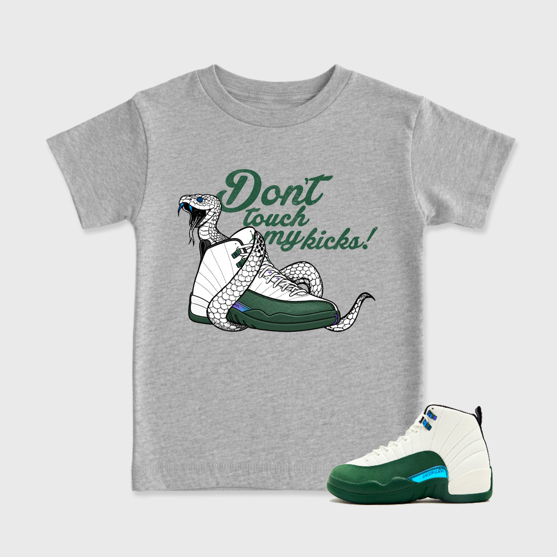 Don't Touch My Kicks Baby & Kids Graphic T-Shirt featuring original artwork designed to match the Air Jordan 12 Summit Green. Heather Grey 1 Kids Graphic Tee.