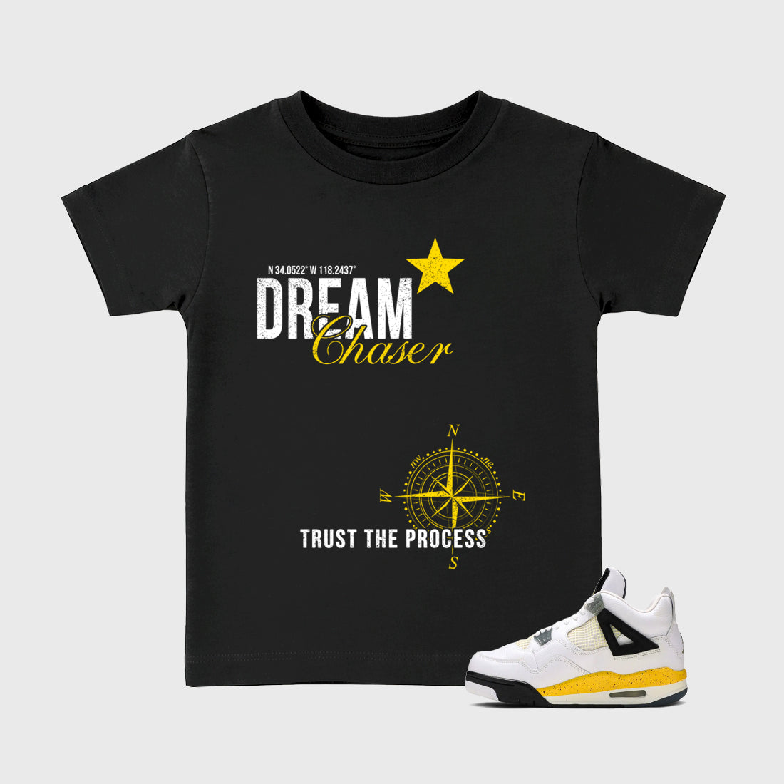 Dream Chaser Baby & Kids Graphic T-Shirt featuring original artwork designed to match the Air Jordan 4 Tour Yellow. Black 1 Kids Graphic Tee.