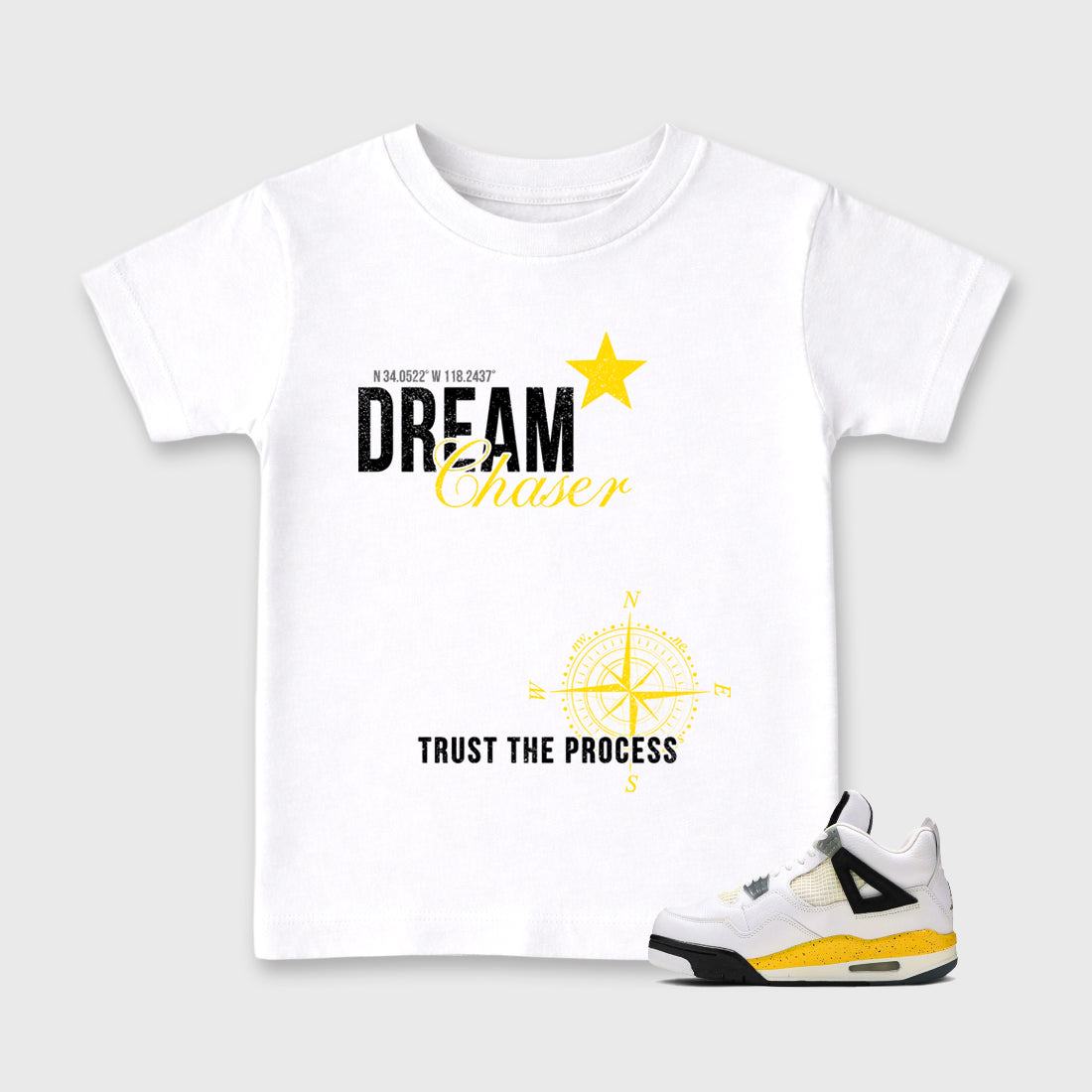 Dream Chaser Baby & Kids Graphic T-Shirt featuring original artwork designed to match the Air Jordan 4 Tour Yellow. White 1 Kids Graphic Tee.