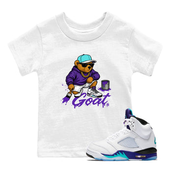 Drip The GOAT baby and kids t-shirt crafted for little sneakerheads to shine with the Jordan 5 Retro Grape sneakers, displayed in White 1.