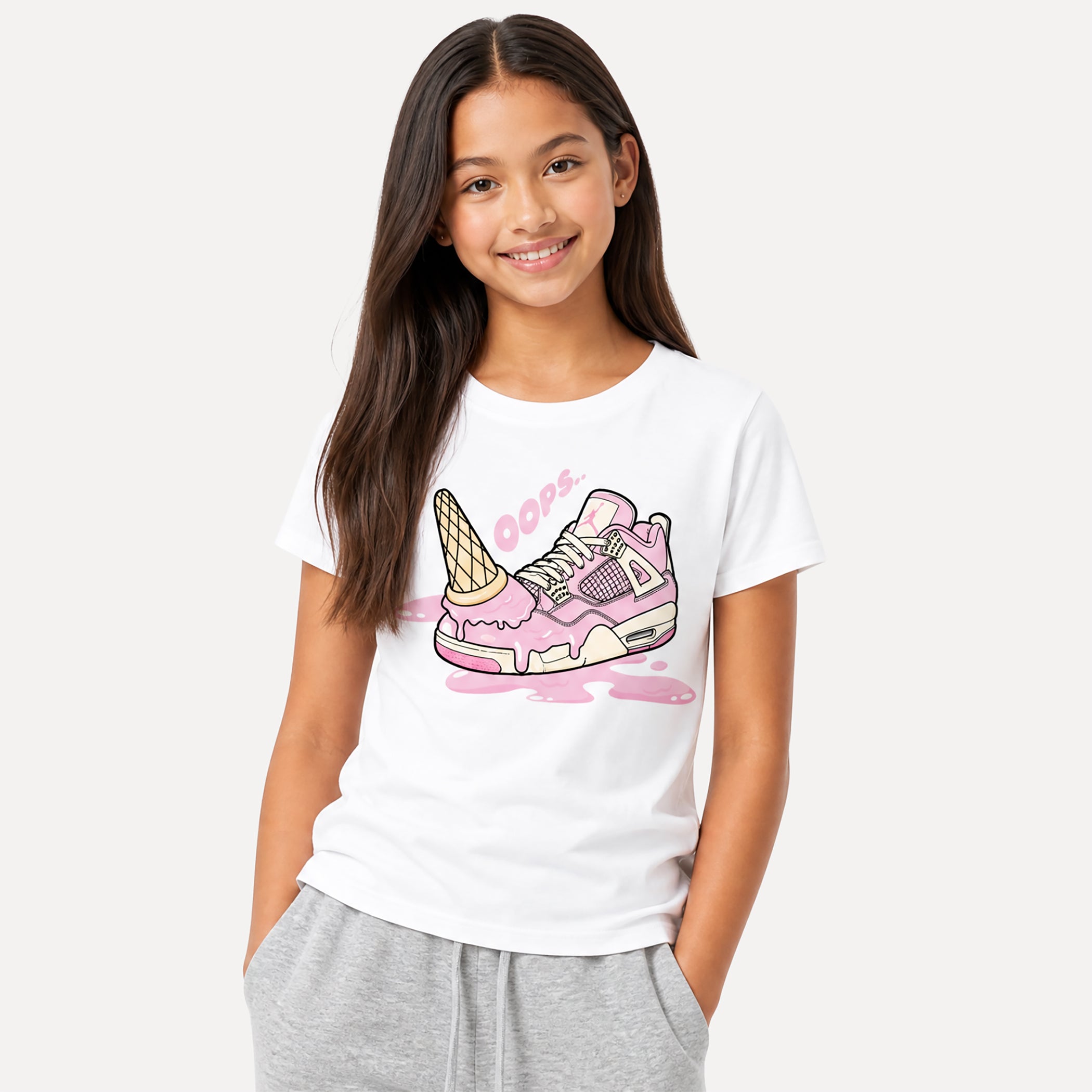 Young girl wearing a white t-shirt with a colorful ice cream-themed graphic design on a plain background