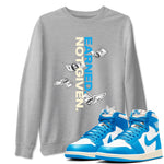 Earned Not Given sneaker match t-shirt styled to complete your fit with the Air Jordan 1 UNC Reimagined sneakers, shown in Heather Grey 1.