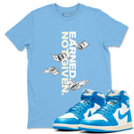 Earned Not Given sneaker match t-shirt styled to complete your fit with the Air Jordan 1 UNC Reimagined sneakers, shown in Carolina Blue 1.