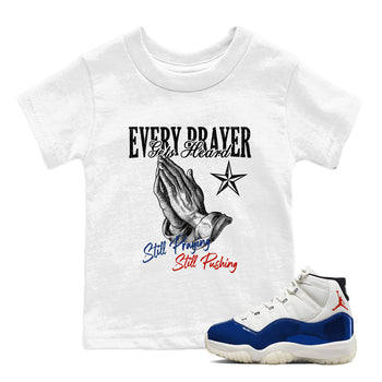 White t-shirt with graphic design and a blue and white sneaker on a white background