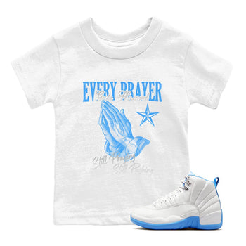 Every Prayer Gets Heard baby and kids t-shirt crafted for little sneakerheads to shine with the Air Jordan 12 White and University Blue sneakers, displayed in White 1.