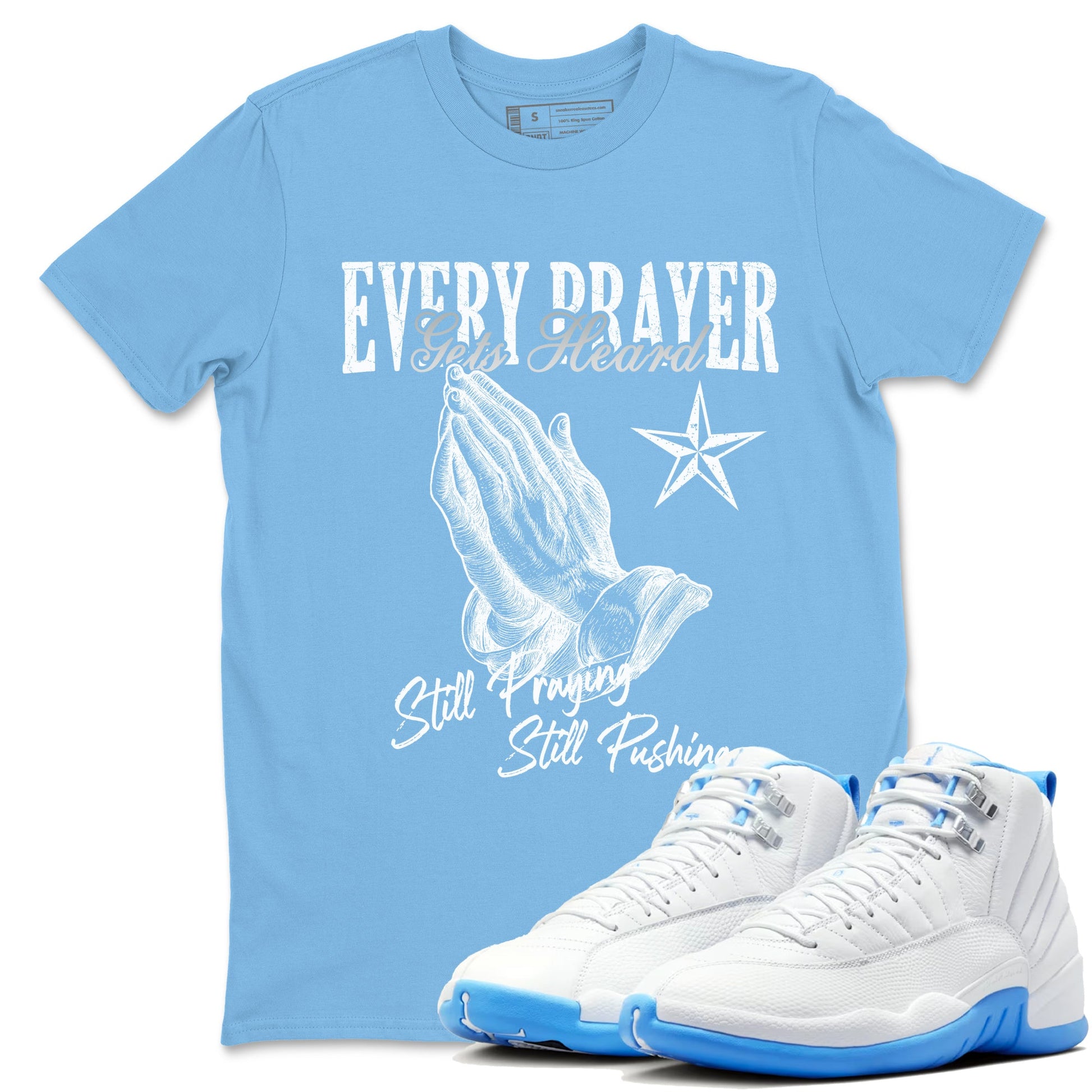 Every Prayer Gets Heard sneaker match t-shirt styled to complete your fit with the Air Jordan 12 White and University Blue sneakers, shown in Carolina Blue 1.