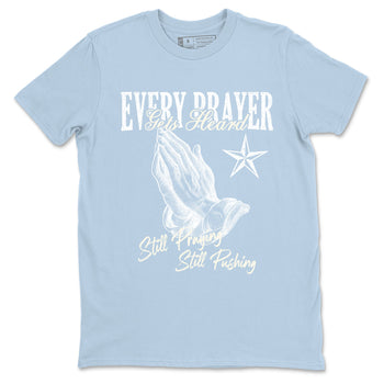 Every Prayer Gets Heard sneaker match t-shirt styled to complete your fit with the Air Jordan 4 Aluminum sneakers, shown in Light Blue 2.