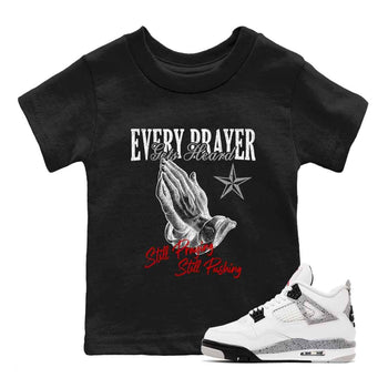 Every Prayer Gets Heard baby and kids t-shirt crafted for little sneakerheads to shine with the Air Jordan 4 White Cement sneakers, displayed in Black 1.